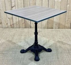Modern Bistro Table, Cast Iron Base, Laminated Top -Room Fold Zone 61589135 07af 472b b8e6 ea2d94a9dde6